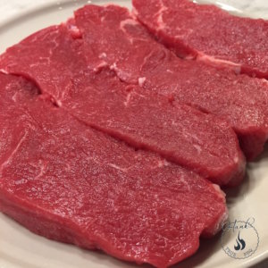 Raw sirloin steaks